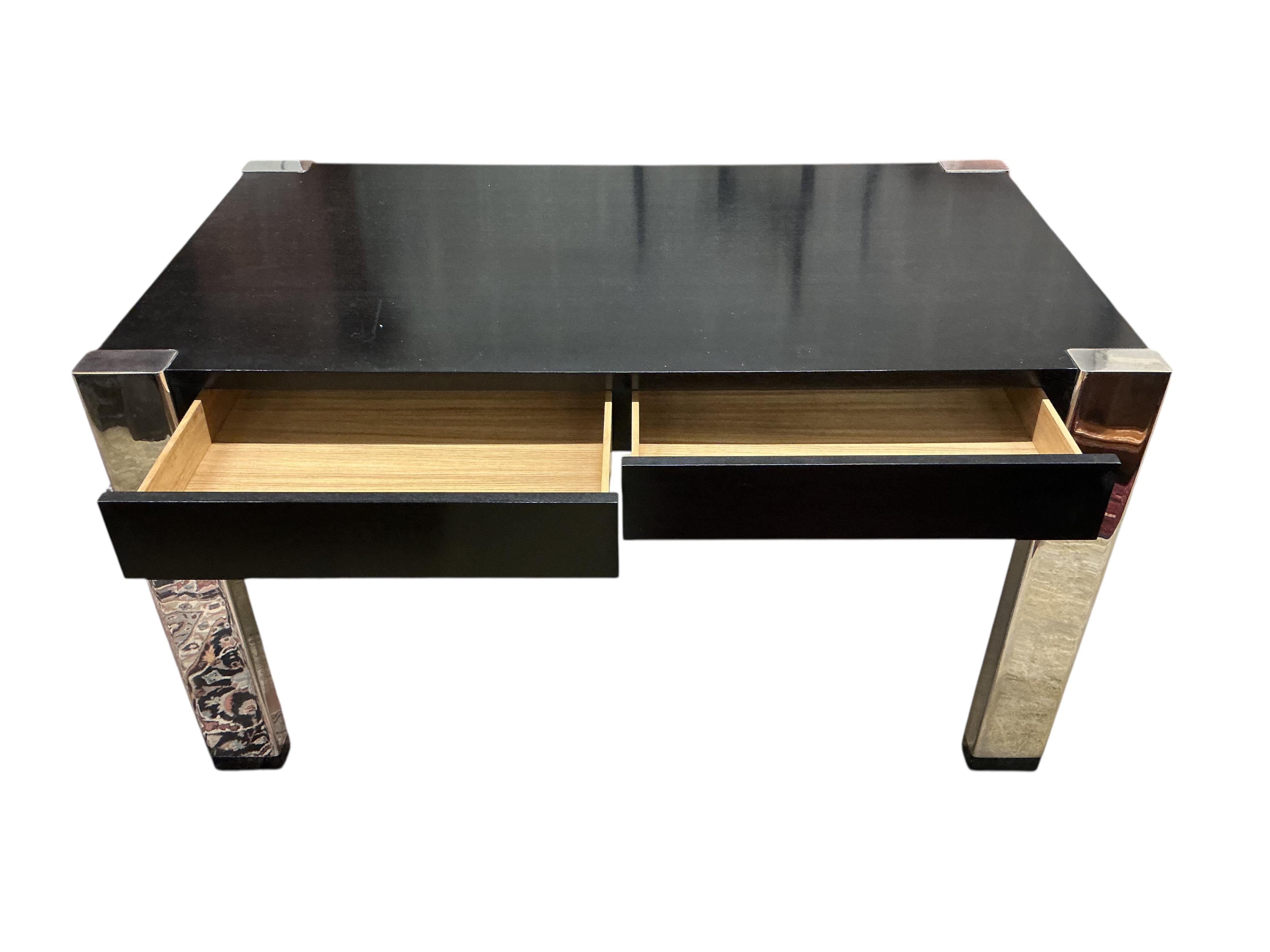 A Contemporary ebonised and chrome desk, retailed by Harrods, width 139cm, depth 78cm, height 78cm
